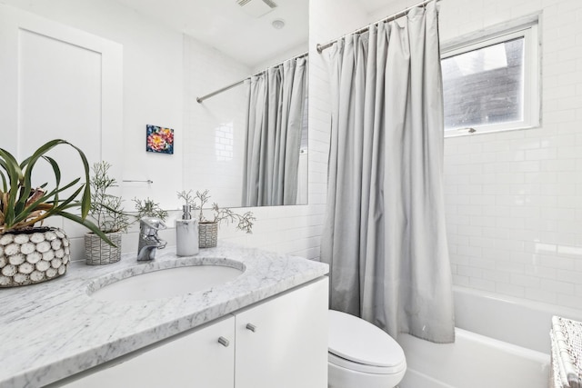 844 W Webster Ave, Chicago, IL 60614 - bathroom featuring shower / bath combination with curtain, toilet, vanity, and visible vents
