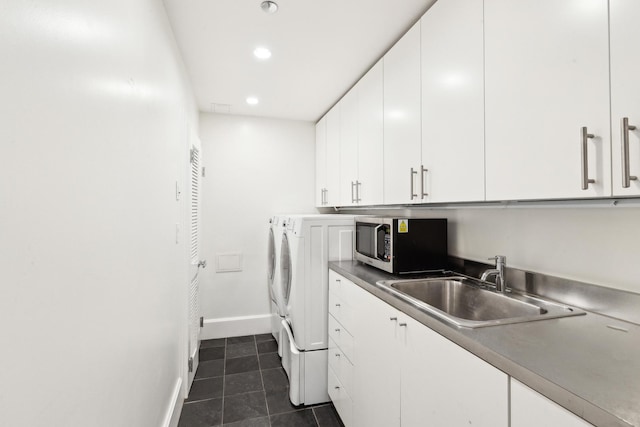 844 W Webster Ave, Chicago, IL 60614 - laundry room with washing machine and dryer, a sink, dark tile patterned flooring, baseboards, and recessed lighting