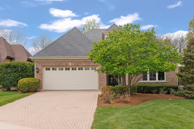 1N598 Golf View Ln, Winfield, IL 60190 - view of front of property with brick siding, a garage, a front yard, and decorative driveway