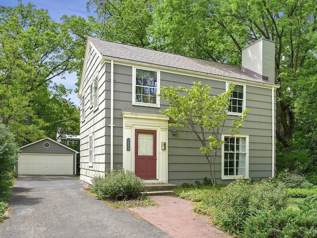 1325 Gilbert Ave, Downers Grove, IL 60515 - view of front of house with an outdoor structure, a chimney, and a garage