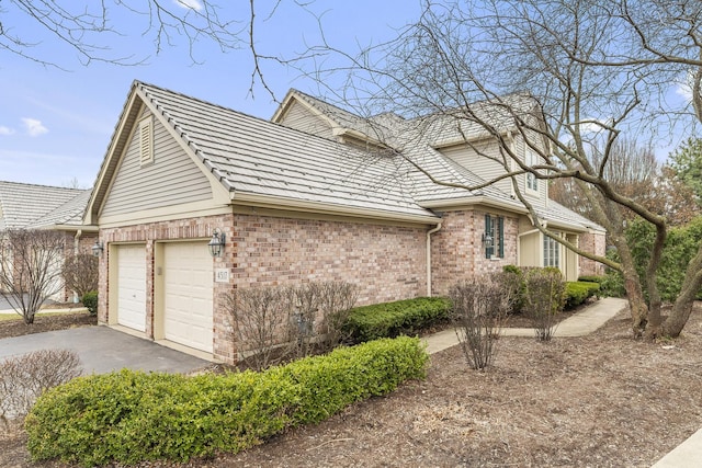 4517 S Seminole Dr, Glenview, IL 60026 - view of side of property featuring brick siding, a garage, and driveway