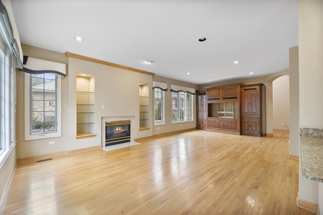 4517 S Seminole Dr, Glenview, IL 60026 - unfurnished living room featuring visible vents, baseboards, and light wood-type flooring