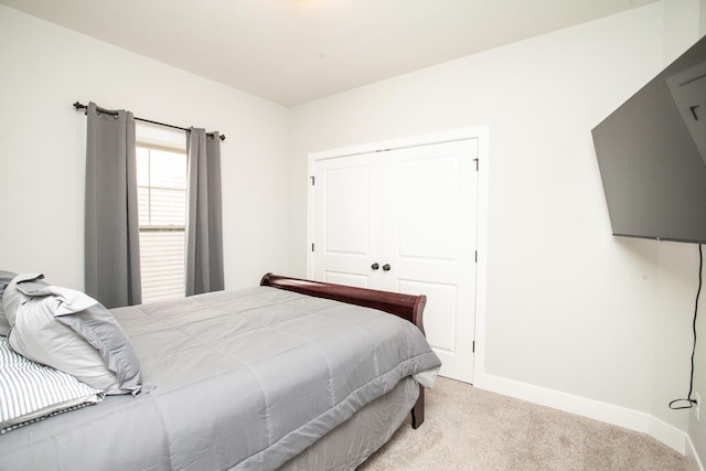 1805 Glenbridge Rd, Bloomington, IL 61704 - bedroom featuring baseboards, carpet flooring, and a closet