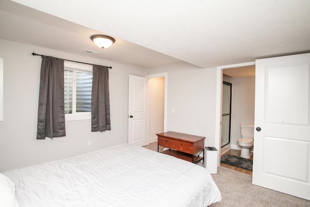 1805 Glenbridge Rd, Bloomington, IL 61704 - bedroom featuring ensuite bath, visible vents, and light carpet