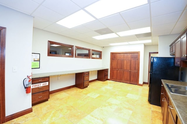 1805 Glenbridge Rd, Bloomington, IL 61704 - unfurnished office with baseboards, a paneled ceiling, and built in desk