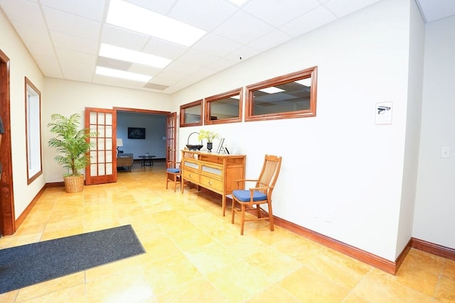 1805 Glenbridge Rd, Bloomington, IL 61704 - living area with baseboards, french doors, and a drop ceiling