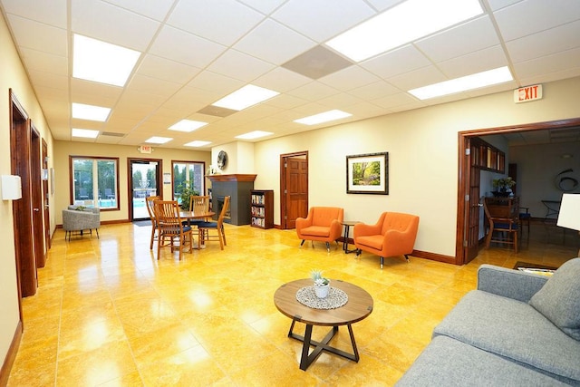 1805 Glenbridge Rd, Bloomington, IL 61704 - living area featuring a paneled ceiling and baseboards