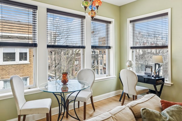 dining room featuring baseboards and wood finished floors