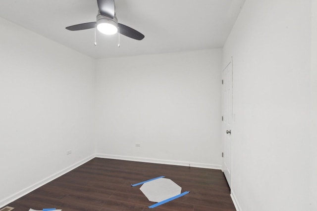 spare room with a ceiling fan, baseboards, and wood finished floors