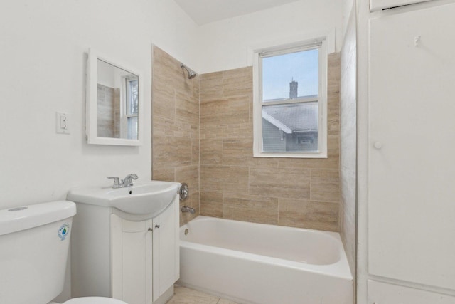 bathroom featuring toilet, vanity, and washtub / shower combination