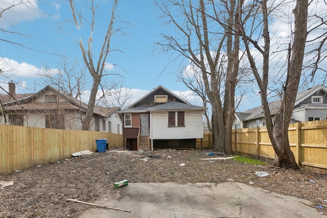 view of front of home featuring a fenced backyard
