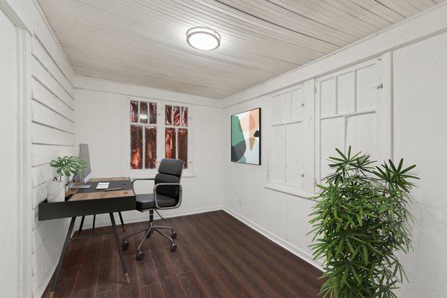 office featuring baseboards and wood finished floors