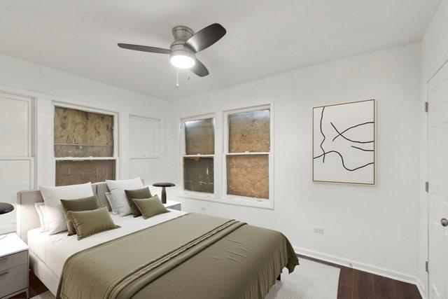 bedroom with baseboards, a ceiling fan, and dark wood-style flooring
