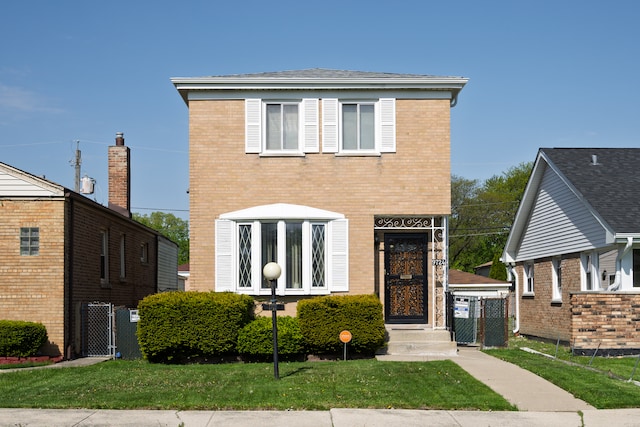 9724 S Princeton Ave, Chicago, IL 60628 - view of front facade with a gate and brick siding