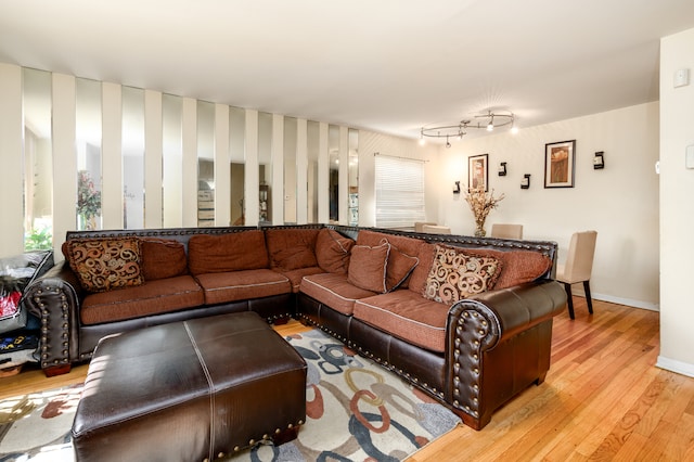 9724 S Princeton Ave, Chicago, IL 60628 - living area with light wood-style floors, baseboards, and wallpapered walls