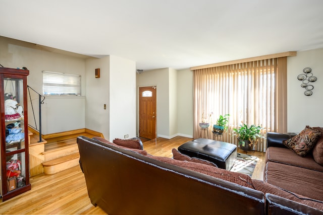 9724 S Princeton Ave, Chicago, IL 60628 - living area featuring light wood-style floors, baseboards, and stairs