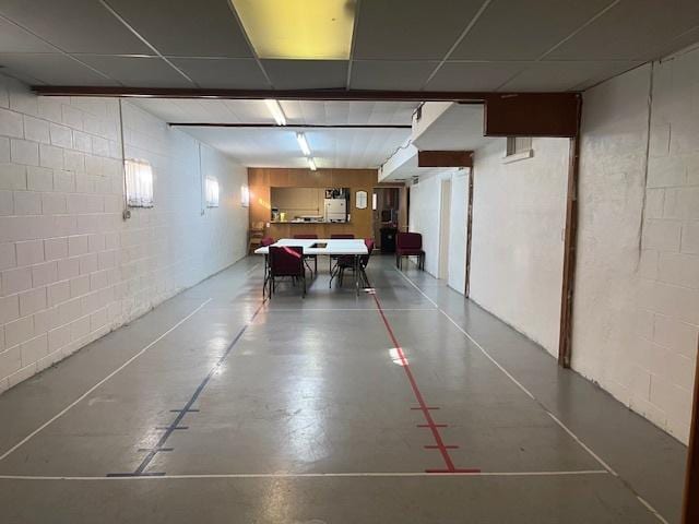 below grade area featuring concrete block wall