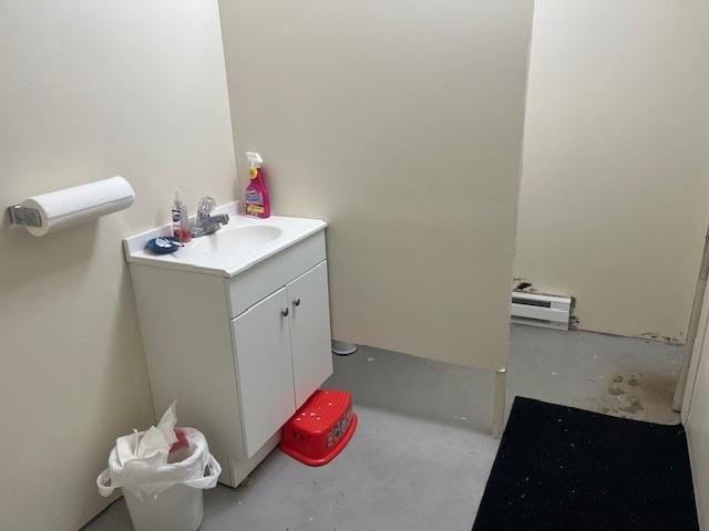 bathroom with unfinished concrete flooring and vanity