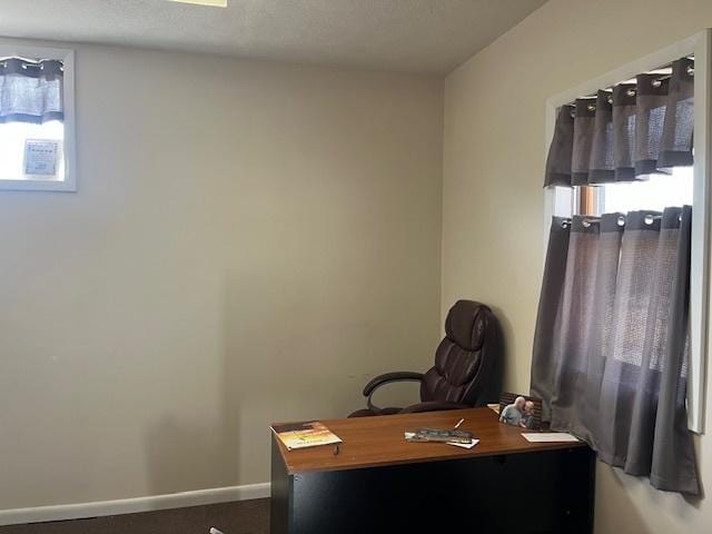 office space with baseboards