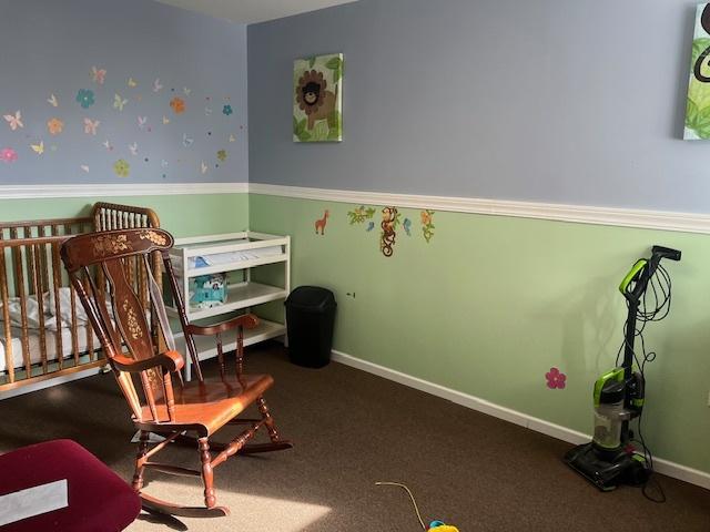 bedroom featuring baseboards and carpet flooring