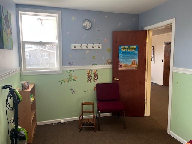 living area featuring carpet flooring