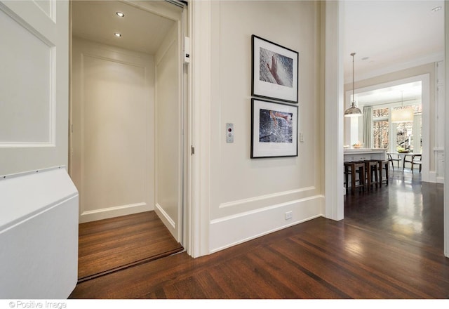 1853 N Burling St, Chicago, IL 60614 - corridor featuring dark wood-style flooring, ornamental molding, baseboards, elevator, and recessed lighting