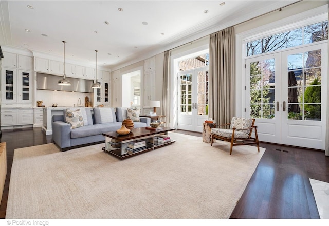 1853 N Burling St, Chicago, IL 60614 - living area featuring french doors, dark wood-style floors, crown molding, and recessed lighting