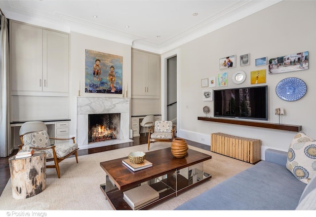 1853 N Burling St, Chicago, IL 60614 - carpeted living room featuring ornamental molding, a fireplace, and radiator
