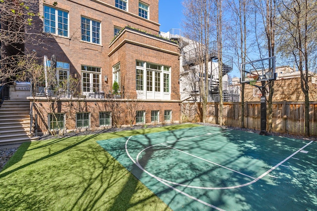 1853 N Burling St, Chicago, IL 60614 - view of basketball court featuring basketball court and stairway