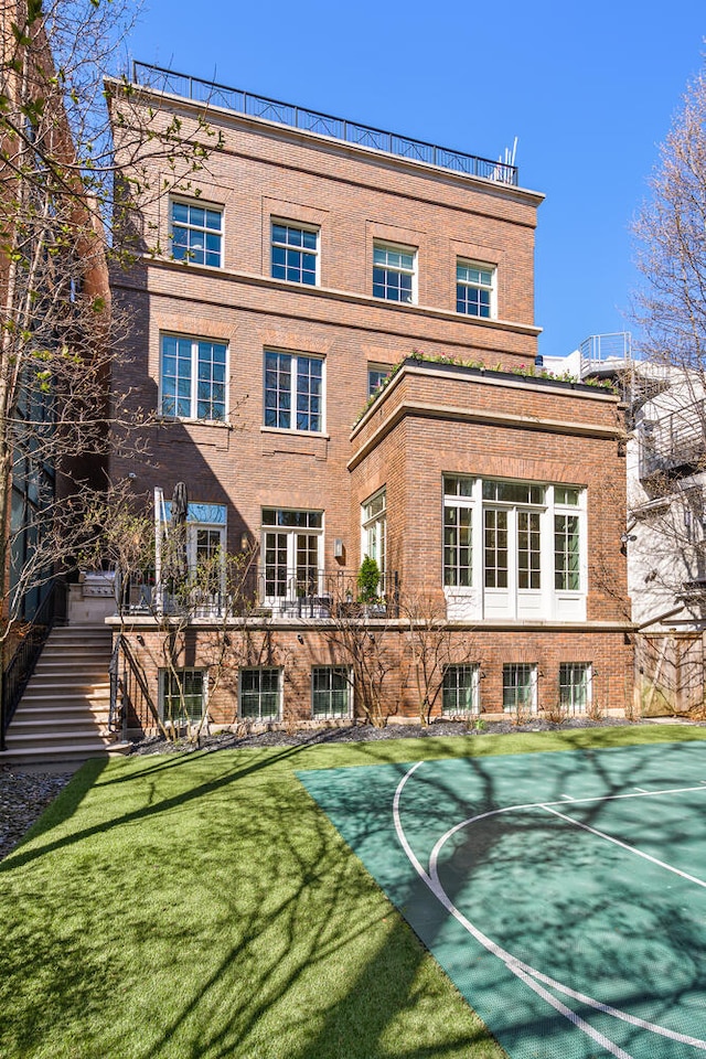 1853 N Burling St, Chicago, IL 60614 - back of property featuring brick siding and a lawn