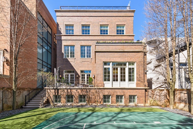 1853 N Burling St, Chicago, IL 60614 - view of sport court with basketball hoop, stairs, and a yard