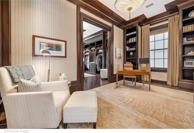1853 N Burling St, Chicago, IL 60614 - sitting room with wood finished floors, an office area, wallpapered walls, baseboards, and ornamental molding
