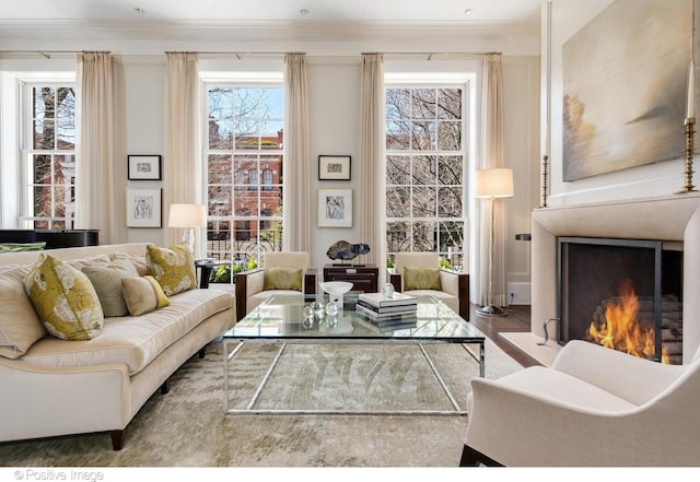 1853 N Burling St, Chicago, IL 60614 - living area with crown molding, wood finished floors, and a lit fireplace