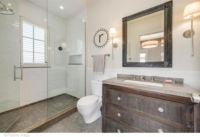 1853 N Burling St, Chicago, IL 60614 - full bath with toilet, a shower stall, vanity, tile patterned flooring, and tile walls
