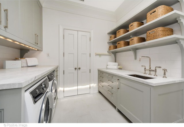 1853 N Burling St, Chicago, IL 60614 - laundry area with cabinet space, washing machine and clothes dryer, and crown molding