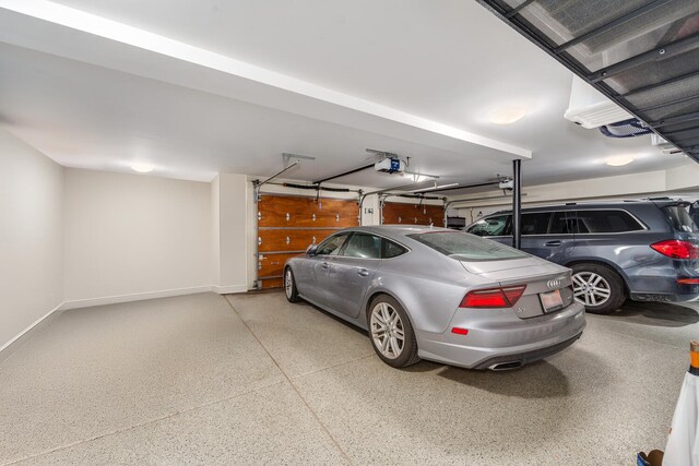 1853 N Burling St, Chicago, IL 60614 - garage with a garage door opener and baseboards