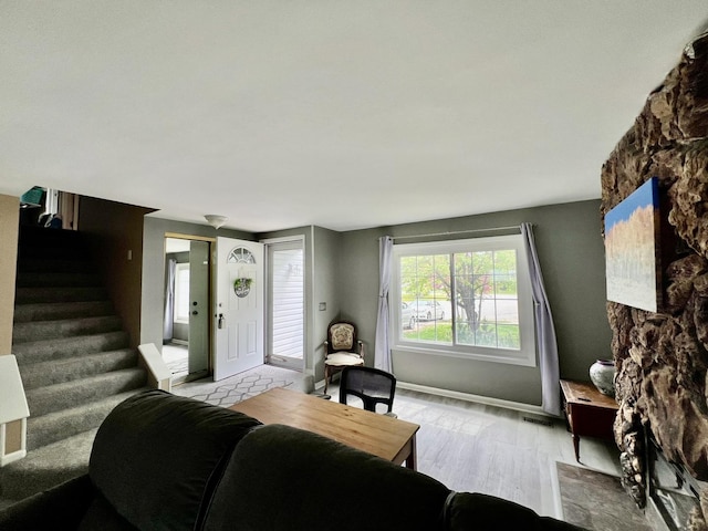2S605 Continental Dr, Warrenville, IL 60555 - living room featuring baseboards, light wood finished floors, and stairs