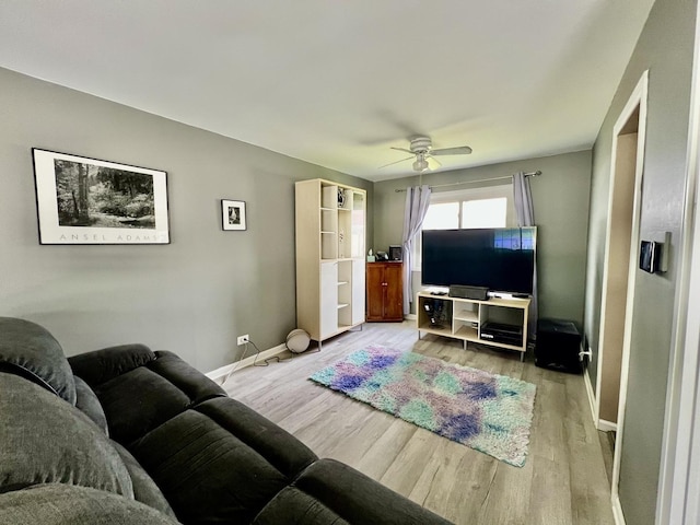 2S605 Continental Dr, Warrenville, IL 60555 - living room with baseboards, a ceiling fan, and wood finished floors