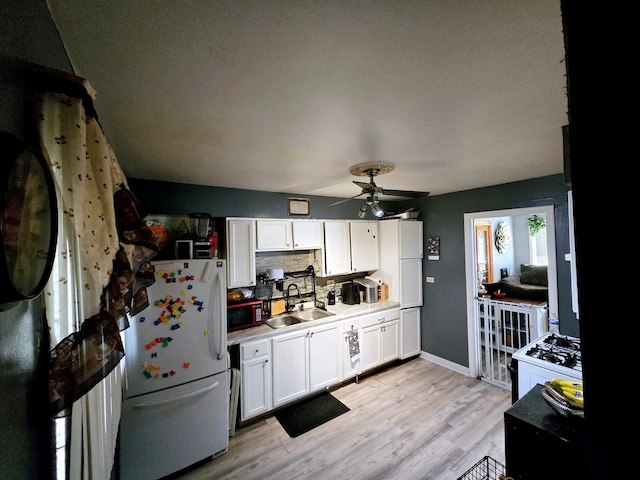 15516 Dorchester Ave, Dolton, IL 60419 - kitchen featuring tasteful backsplash, white appliances, a sink, white cabinets, and a ceiling fan