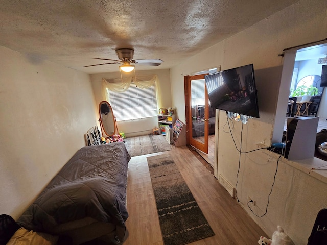 15516 Dorchester Ave, Dolton, IL 60419 - living area with a ceiling fan, a textured ceiling, and wood finished floors