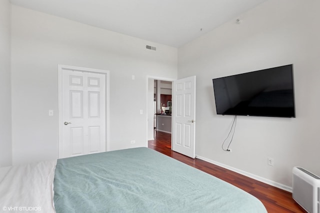 500 E St Charles Rd Unit 510, Lombard, IL 60148 - bedroom featuring baseboards, visible vents, a high ceiling, and dark wood-type flooring