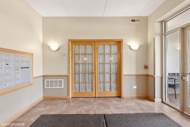 500 E St Charles Rd Unit 510, Lombard, IL 60148 - doorway with baseboards, visible vents, tile patterned flooring, and mail area