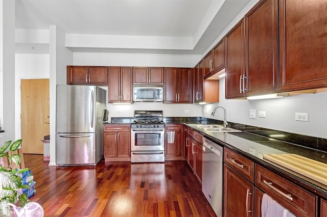 500 E St Charles Rd Unit 510, Lombard, IL 60148 - kitchen featuring a sink, dark wood-style flooring, dark countertops, and stainless steel appliances