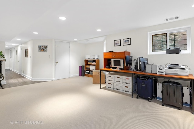 office area featuring visible vents, baseboards, recessed lighting, and light colored carpet