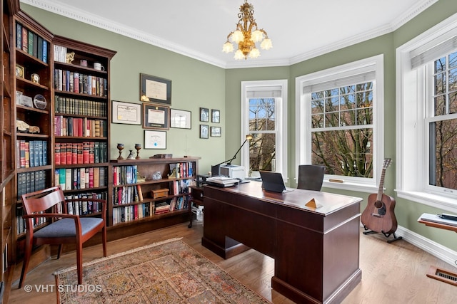 home office featuring wood finished floors, a notable chandelier, ornamental molding, and visible vents