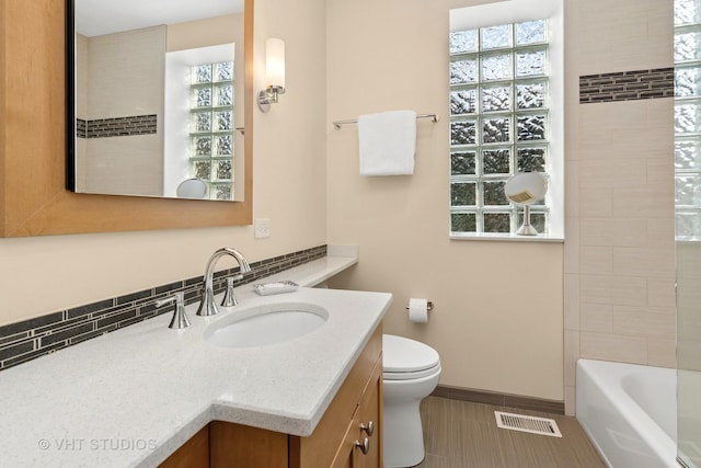 full bath featuring visible vents, baseboards, toilet, vanity, and tile patterned floors