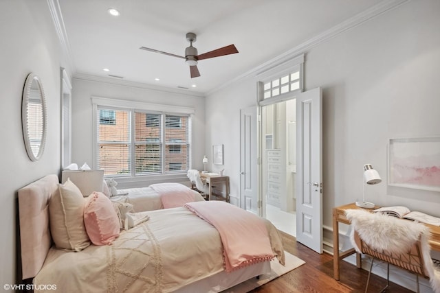 bedroom with crown molding, wood finished floors, ceiling fan, and recessed lighting