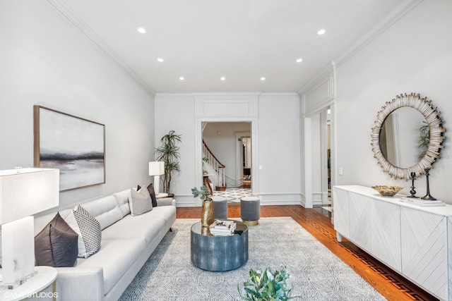 living area featuring recessed lighting, ornamental molding, and wood finished floors