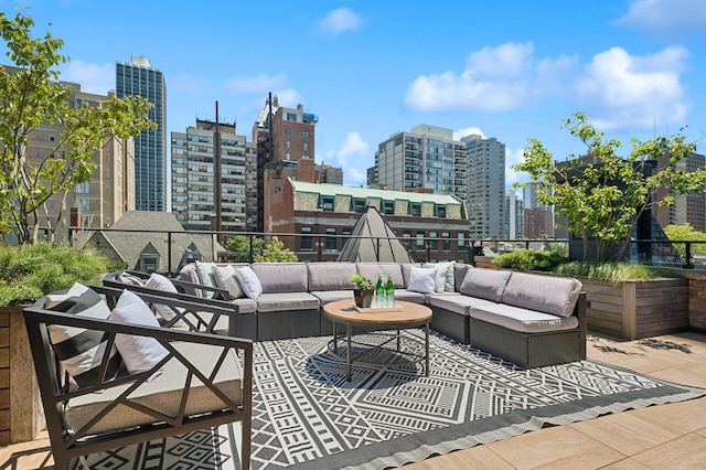 view of patio / terrace featuring outdoor lounge area and a city view