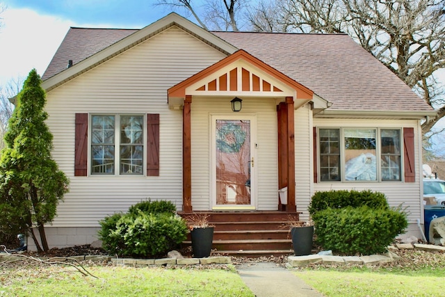 view of front of property with a shingled roof